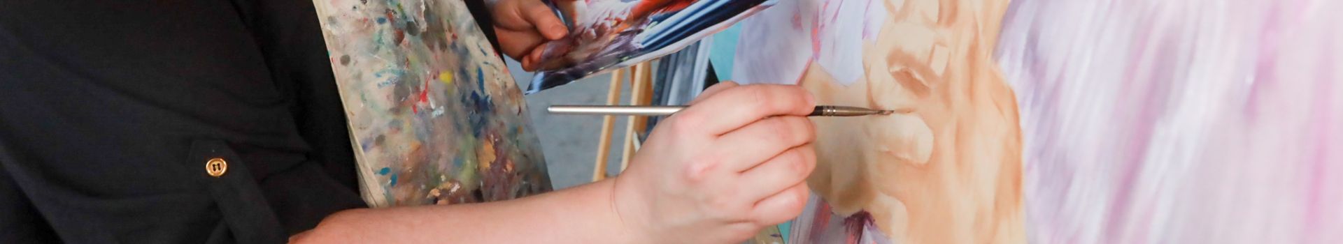 close up of artist's hand, painting